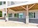 Covered patio area with stone pillars and beautiful views of the lake at 124 Clipper Ln, Mooresville, NC 28117