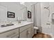 Bright bathroom featuring a vanity with storage, a shower/tub combo, and neutral decor at 1260 Thomas Knapp Pkwy, Fort Mill, SC 29715