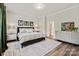 Comfortable bedroom with a large bed, hardwood floors, and plenty of natural light at 1260 Thomas Knapp Pkwy, Fort Mill, SC 29715