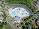 Aerial view of the community pool, featuring multiple pools, splash pad, picnic area and large parking area at 1260 Thomas Knapp Pkwy, Fort Mill, SC 29715