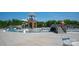 A community pool with a water slide and tower sits next to a picnic area with tables and chairs at 1260 Thomas Knapp Pkwy, Fort Mill, SC 29715