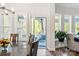 Bright dining space with a large window and access to outdoor balcony seating at 1260 Thomas Knapp Pkwy, Fort Mill, SC 29715