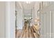 Inviting entryway with hardwood floors, a console table, and views into the living spaces at 1260 Thomas Knapp Pkwy, Fort Mill, SC 29715