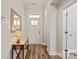 Entryway featuring hardwood floors, console table with lamp, and a decorative mirror at 1260 Thomas Knapp Pkwy, Fort Mill, SC 29715