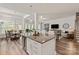 Open floor plan showing the kitchen with island seating flowing into the dining and living areas at 1260 Thomas Knapp Pkwy, Fort Mill, SC 29715
