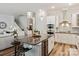 Eat-in kitchen with an island bar, stainless steel appliances, and sleek cabinetry at 1260 Thomas Knapp Pkwy, Fort Mill, SC 29715
