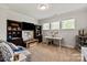 Bright playroom with desk, bookshelves, mounted TV, and plenty of natural light at 1260 Thomas Knapp Pkwy, Fort Mill, SC 29715