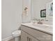 Stylish powder room featuring a modern vanity, white fixtures, and unique decor at 1260 Thomas Knapp Pkwy, Fort Mill, SC 29715