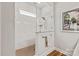 White marble tiled shower with a glass enclosure, overhead shower head, and small built-in shelf at 1260 Thomas Knapp Pkwy, Fort Mill, SC 29715