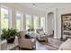 Inviting sitting area with two chairs, large windows offering natural light, and views of the outdoor scenery at 1260 Thomas Knapp Pkwy, Fort Mill, SC 29715