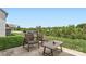 Outdoor patio area with comfortable seating and a view of the lush backyard and neighborhood at 128 Championship Dr, Mooresville, NC 28115