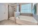 Bathroom with tub and walk-in shower at 128 Championship Dr, Mooresville, NC 28115