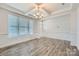 Bright dining area with wood floors, a decorative chandelier, and ample natural light at 128 Championship Dr, Mooresville, NC 28115