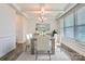 Inviting dining room with wood table, six chairs, and large bright window at 128 Championship Dr, Mooresville, NC 28115