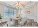 Bright dining room with modern chandelier, coffered ceiling, and large windows at 128 Championship Dr, Mooresville, NC 28115