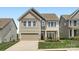 Charming two-story home with a well-manicured lawn, a garage, and inviting curb appeal at 128 Championship Dr, Mooresville, NC 28115