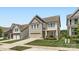 Charming two-story home with neutral siding, stone accents, and a manicured lawn in a suburban neighborhood at 128 Championship Dr, Mooresville, NC 28115