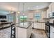 Bright kitchen features granite countertops, stainless appliances, wood-look floors and island at 128 Championship Dr, Mooresville, NC 28115