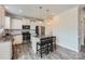 Modern kitchen with white cabinets, stainless steel appliances, and an island with seating at 128 Championship Dr, Mooresville, NC 28115