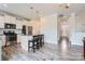 Open concept living space features the kitchen, island, and entry way at 128 Championship Dr, Mooresville, NC 28115
