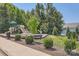Community playground with slides, swings, and play equipment, surrounded by lush landscaping at 128 Championship Dr, Mooresville, NC 28115