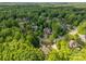 An aerial perspective reveals a neighborhood with distinguished residences surrounded by lush trees and winding streets, offering tranquility at 130 Churchill Dr, Salisbury, NC 28144