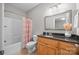 Cozy bathroom with wood cabinets, a granite countertop, and a tub/shower combination at 130 Churchill Dr, Salisbury, NC 28144