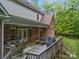 Inviting deck showcases an outdoor dining area and comfortable seating, perfect for entertaining with views of the backyard at 130 Churchill Dr, Salisbury, NC 28144