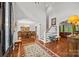 Spacious foyer featuring hardwood floors, a chandelier, and views of the formal dining and living areas at 130 Churchill Dr, Salisbury, NC 28144