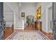 Grand foyer with hardwood floors, a high ceiling, staircase, and elegant decor at 130 Churchill Dr, Salisbury, NC 28144