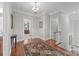Upstairs hallway with hardwood floors, rug and visible entrances to other rooms at 130 Churchill Dr, Salisbury, NC 28144