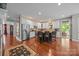 Open kitchen featuring white cabinets, stainless steel appliances, and a center island with seating at 130 Churchill Dr, Salisbury, NC 28144