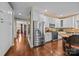 Modern kitchen with stainless steel appliances, white cabinetry and a view into the dining room at 130 Churchill Dr, Salisbury, NC 28144