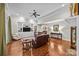 Open living room with hardwood floors, ceiling fan, built-in shelving, and comfortable seating at 130 Churchill Dr, Salisbury, NC 28144