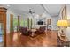 Spacious living room with hardwood floors, ceiling fan, built-in shelving, and leather furniture at 130 Churchill Dr, Salisbury, NC 28144