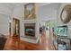 Elegant living room features a fireplace, hardwood floors, and an open view to the kitchen at 130 Churchill Dr, Salisbury, NC 28144