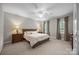 A primary bedroom featuring neutral decor, a ceiling fan, and natural light from large windows at 130 Churchill Dr, Salisbury, NC 28144