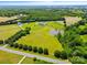 Drone shot of land and horse property, including the house, pond and barn at 1351 Highway 324 None, Rock Hill, SC 29730