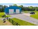Large blue barn with white doors, situated on a well-maintained property at 1351 Highway 324 None, Rock Hill, SC 29730