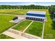 Aerial view of a barn with horse paddocks and a truck in the driveway at 1351 Highway 324 None, Rock Hill, SC 29730
