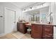 Bathroom featuring dual sinks with granite counters, custom cabinets, and a walk-in shower at 1351 Highway 324 None, Rock Hill, SC 29730