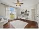 Bright bedroom features large windows, hardwood floors, and an attached bathroom at 1351 Highway 324 None, Rock Hill, SC 29730