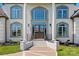Elegant home entrance with double doors, columns, and arched window, creating a grand first impression at 1351 Highway 324 None, Rock Hill, SC 29730
