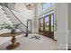 Grand foyer with high ceilings, hardwood floors, staircase, and elegant decor, creating a welcoming ambiance at 1351 Highway 324 None, Rock Hill, SC 29730