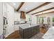 Stunning kitchen features a large island, wood beams, modern appliances, and an adjacent dining area at 1351 Highway 324 None, Rock Hill, SC 29730