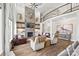 A grand living room boasts a stone fireplace, high ceilings, and comfortable seating at 1351 Highway 324 None, Rock Hill, SC 29730