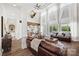 An open-concept living room features high ceilings, large windows, and stylish furnishings at 1351 Highway 324 None, Rock Hill, SC 29730