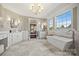 A luxurious bathroom features a soaking tub, double vanity, chandelier, and natural light at 1351 Highway 324 None, Rock Hill, SC 29730