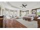 A spacious main bedroom is adorned with hardwood floors, decorative doors, and natural light at 1351 Highway 324 None, Rock Hill, SC 29730