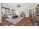 Spacious main bedroom showcasing hardwood floors, large rug, and natural light at 1351 Highway 324 None, Rock Hill, SC 29730